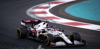 A formula 1 race car on a turn in a race