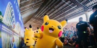 People at an anime convention looking at pikachu