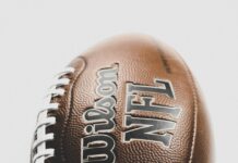 How to Watch the 2023 NFL Draft A close-up of a leather Wilson NFL football