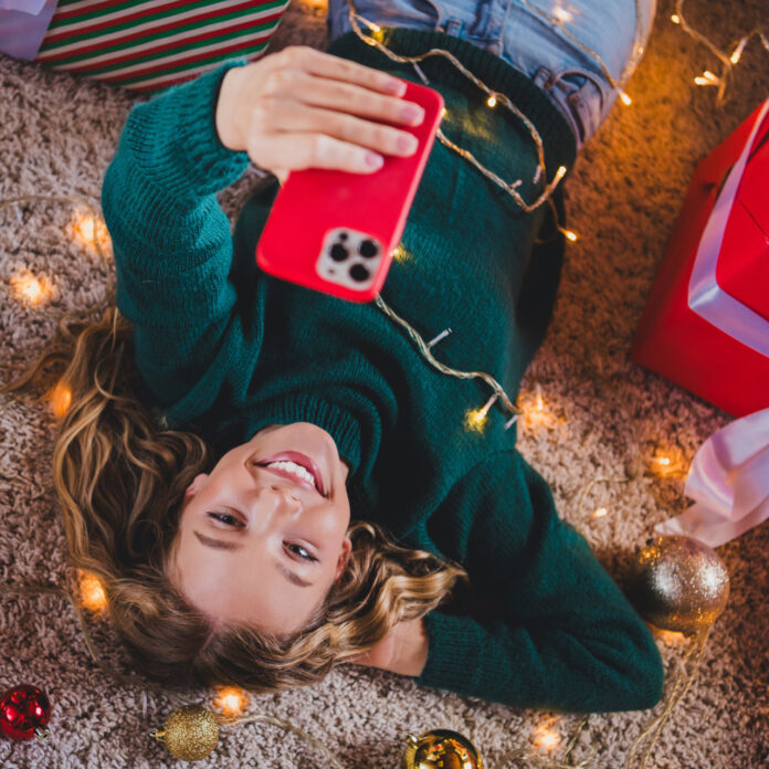 Teen with mobile phone technology holiday gift