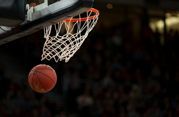 markus-spiske-BfphcCvhl6E-unsplash A basketball swishing through a basketball hoop.